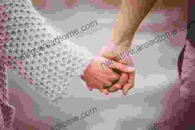 A Couple Holding Hands, Symbolizing The Importance Of Attachment In Adult Relationships Attachment Theory In Adult Mental Health: A Guide To Clinical Practice