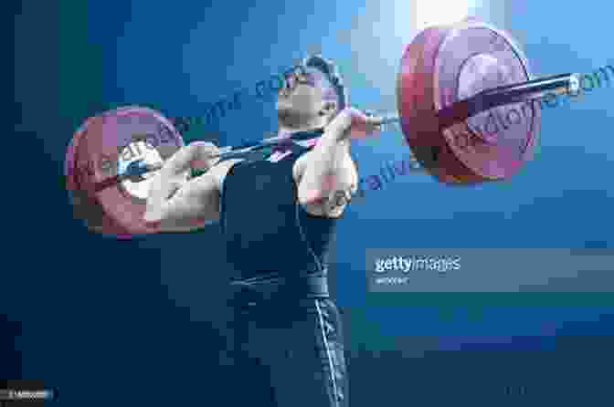 A Weightlifter Performing A Clean And Jerk Olympic Weightlifting: A Complete Guide For Athletes Coaches