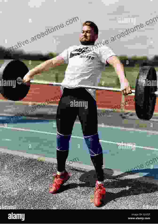 A Weightlifter Performing A Snatch Olympic Weightlifting: A Complete Guide For Athletes Coaches