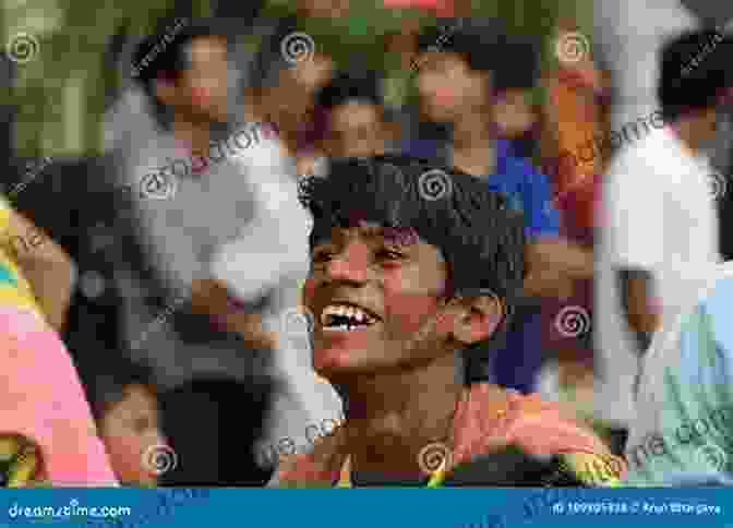 A Young Boy Smiles As He Plays In The Streets Of Mumbai, India. Documenting Asia Volume 5: Documentary Photography From Asia And South East Asia (Documenting Asia By Julian Bound)